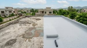 Flat roof shown half-finished, with cracked old surface on one side and fresh waterproof coating being rolled on the other